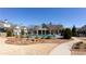 Community pool surrounded by meticulously landscaped grounds, offering a serene retreat on a bright, sunny day at 341 Little Pine Ln, Woodstock, GA 30188