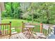 Inviting back deck with outdoor seating and view of the landscaped backyard at 4481 Mclain Cir, Acworth, GA 30101