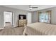 Primary bedroom featuring carpet, ceiling fan, television and ensuite access at 4481 Mclain Cir, Acworth, GA 30101