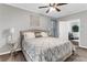Bedroom with bed, ceiling fan, neutral carpet, and stylish decor at 4481 Mclain Cir, Acworth, GA 30101