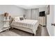 Relaxing bedroom featuring a comfortable bed, stylish side tables, and soft lighting for a cozy ambiance at 4481 Mclain Cir, Acworth, GA 30101