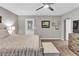 Bright bedroom features a ceiling fan, furniture, neutral walls, and carpet at 4481 Mclain Cir, Acworth, GA 30101