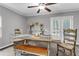 Charming dining room with a ceiling fan, rustic table, bench and outdoor access at 4481 Mclain Cir, Acworth, GA 30101