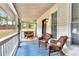 Inviting screened porch with wicker furniture, offering a comfortable outdoor living space at 4481 Mclain Cir, Acworth, GA 30101