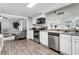 Modern kitchen seamlessly flows into the living area, creating an ideal space for cooking and entertaining at 4481 Mclain Cir, Acworth, GA 30101