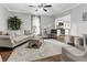 Bright living room with hardwood floors, neutral decor, and an open view of the kitchen at 4481 Mclain Cir, Acworth, GA 30101