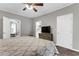 Spacious main bedroom with ceiling fan and decorative bedding, adjoining living area, and en suite at 4481 Mclain Cir, Acworth, GA 30101