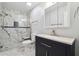 Remodeled bathroom with glass shower, updated vanity, and modern fixtures at 1108 Gwens Sw Trl, Lilburn, GA 30047