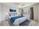 Comfortable bedroom with a plush bed, soft rug, and natural light at 1108 Gwens Sw Trl, Lilburn, GA 30047