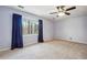 Cozy bedroom with natural light, ceiling fan, and neutral carpet at 1108 Gwens Sw Trl, Lilburn, GA 30047