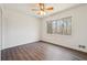 Empty bedroom with ceiling fan, laminate floors and a view of the woods at 1108 Gwens Sw Trl, Lilburn, GA 30047