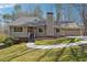 Charming single-Gathering home boasts an inviting front yard and attached two-car garage at 1108 Gwens Sw Trl, Lilburn, GA 30047