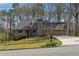 Charming single-Gathering home boasts an inviting front yard and attached two-car garage at 1108 Gwens Sw Trl, Lilburn, GA 30047