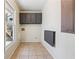 Functional laundry room with folding table, overhead cabinets, and window at 1108 Gwens Sw Trl, Lilburn, GA 30047