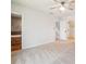 Carpeted main bedroom with ceiling fan and access to the luxurious bathroom with a tub at 1108 Gwens Sw Trl, Lilburn, GA 30047