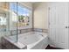 Relaxing bathroom with separate tub and glass shower provides bright natural light at 3102 Ballet Se Ct, Smyrna, GA 30082