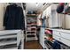 Walk-in closet with custom shelving offers ample storage for clothing and accessories at 3102 Ballet Se Ct, Smyrna, GA 30082