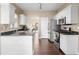 Well-lit kitchen with stainless appliances, granite countertops, and white cabinets at 3102 Ballet Se Ct, Smyrna, GA 30082