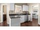 Galley kitchen features white cabinets, stainless steel appliances, and granite countertops at 3102 Ballet Se Ct, Smyrna, GA 30082