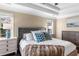 Elegant primary bedroom features a tray ceiling, a tufted bed and bedside tables at 3102 Ballet Se Ct, Smyrna, GA 30082