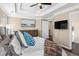 Spacious bedroom boasts tray ceiling, artwork, mounted TV, and a calming color palette at 3102 Ballet Se Ct, Smyrna, GA 30082