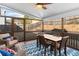 A screened-in porch with a ceiling fan and outdoor furniture at 3102 Ballet Se Ct, Smyrna, GA 30082