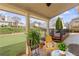 Enjoy outdoor living on this covered patio with ceiling fan overlooking a well-manicured lawn and landscaped backyard at 4397 Challedon Dr, South Fulton, GA 30213