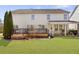 Large backyard features a deck, covered patio, and plenty of green space for entertaining and recreation at 4397 Challedon Dr, South Fulton, GA 30213