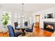 Cozy breakfast nook with fireplace, bright windows and table with seating at 4397 Challedon Dr, South Fulton, GA 30213