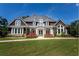 Charming single-Gathering home with manicured lawn, beautiful landscaping, and traditional architectural details at 4397 Challedon Dr, South Fulton, GA 30213