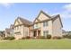 Charming two-story home with a manicured lawn, brick accents, and a two-car garage in a desirable neighborhood at 4397 Challedon Dr, South Fulton, GA 30213