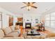 Inviting living room with fireplace, hardwood floors, and open access to the kitchen at 4397 Challedon Dr, South Fulton, GA 30213