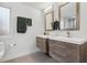 Modern bathroom featuring double sink vanity with clean lines and a large, illuminated mirror at 2336 Mark Trl, Decatur, GA 30032