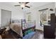 Inviting bedroom with a dark metal bed frame, hard wood floors, and natural light, offering a cozy and comfortable atmosphere at 2336 Mark Trl, Decatur, GA 30032