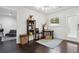 Cozy dining area with dark hardwood floors, modern decor, and natural light from the door at 2336 Mark Trl, Decatur, GA 30032