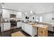 Bright kitchen featuring stainless steel appliances, center island, and modern white cabinetry at 2336 Mark Trl, Decatur, GA 30032