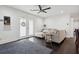 Well-lit living room boasts hardwood floors, a plush gray sofa, and stylish French doors at 2336 Mark Trl, Decatur, GA 30032