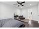 Spacious main bedroom with a ceiling fan, dresser and doorway to an en-suite bath at 2336 Mark Trl, Decatur, GA 30032