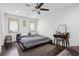 Relaxing main bedroom with ceiling fan, dresser and ample natural light at 2336 Mark Trl, Decatur, GA 30032