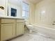 Bathroom featuring a white vanity, white fixtures and a tub-shower combo at 3060 Scepter Dr, Duluth, GA 30096