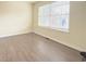 Bedroom with vinyl floors, a window with blinds and base molding at 3060 Scepter Dr, Duluth, GA 30096