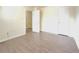 Bedroom with vinyl floors, neutral walls, and a door to another room at 3060 Scepter Dr, Duluth, GA 30096