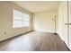 Bedroom with vinyl floors, neutral walls, a window with blinds and base molding at 3060 Scepter Dr, Duluth, GA 30096