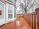 View of wooden deck with brown railing and window features on home exterior at 3060 Scepter Dr, Duluth, GA 30096