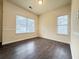 Bright dining area with neutral walls, wood floors, and natural light from large windows at 3060 Scepter Dr, Duluth, GA 30096