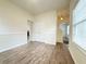 Bright living room featuring hardwood floors, neutral paint, and staircase at 3060 Scepter Dr, Duluth, GA 30096