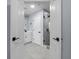 View of the bathroom showcasing a dual sink vanity, with tile floors and a large glass enclosed shower at 3266 Spicy Cedar Ln, Lithonia, GA 30038