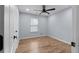 Inviting bedroom with wood flooring, ceiling fan, and natural light, creating a relaxing atmosphere at 3266 Spicy Cedar Ln, Lithonia, GA 30038