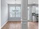 Cozy breakfast nook with hardwood floors and a modern chandelier by the window at 3266 Spicy Cedar Ln, Lithonia, GA 30038