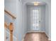 Hallway with hardwood flooring, light gray paint and a staircase to the second floor at 3266 Spicy Cedar Ln, Lithonia, GA 30038